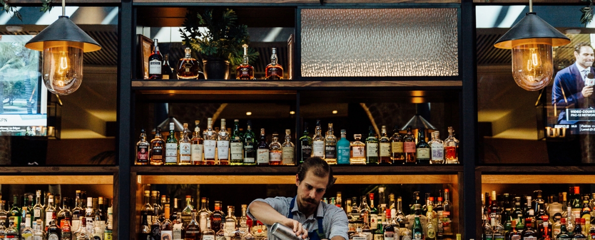 A bartender mixes a drink at Press Room in New Orleans