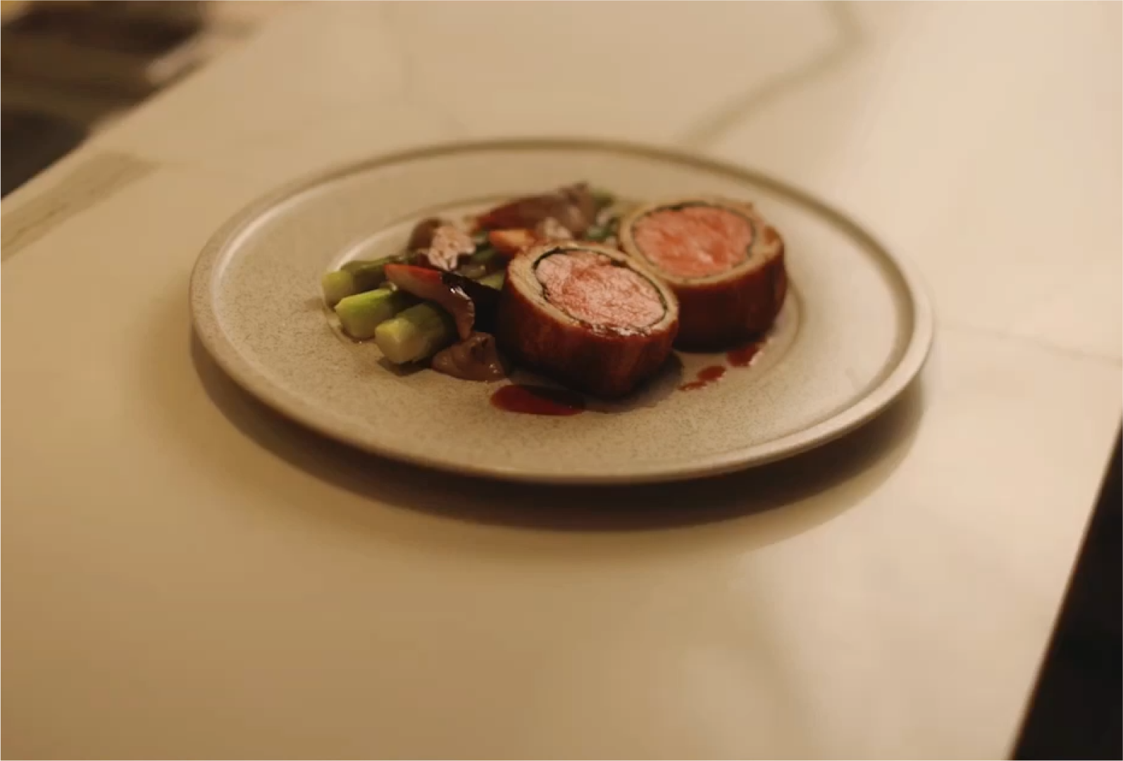 A beef wellington and asparagus dish served by the Eliza Jane catering team in New Orleans